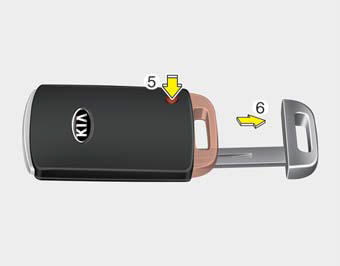 To remove the mechanical key, press and hold the release button(1) and remove