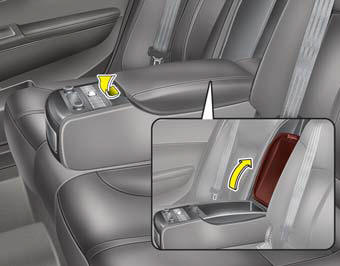 To open the rear seat storage, pull up the lever.