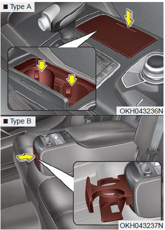 Cups or small beverage cans may be placed in the cup holders.