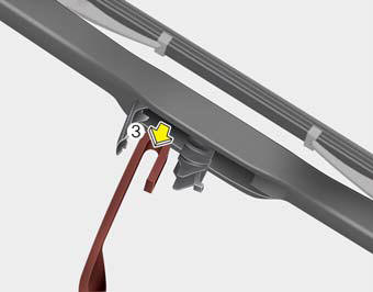 4.Push down the wiper arm (3) and install the new blade assembly in the reverse